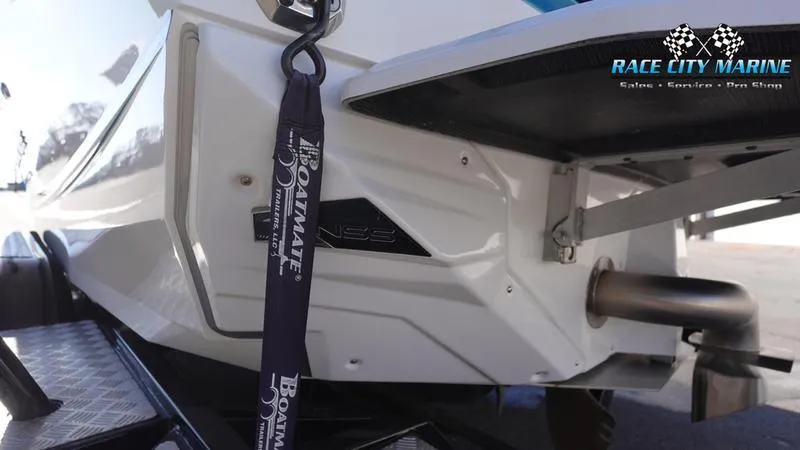 Slide: The Image of 2019 Nautique Super Air Nautique GS20 boat rear view with Race City Marine branding. - 9