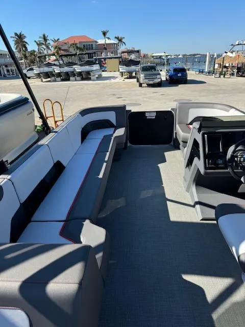 Slide: The Image of 2025 Manitou 22' Cruise Bench Twin Tube pontoon boat interior with spacious seating. - 4