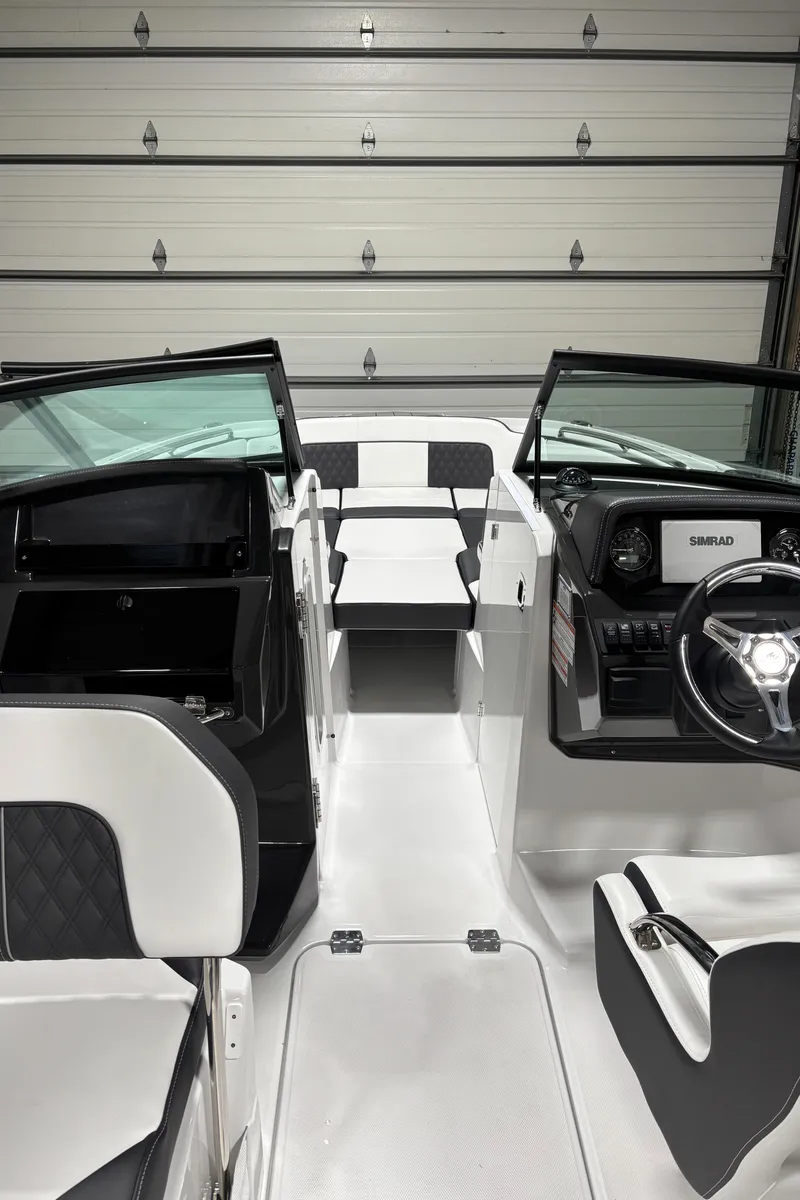 Slide: The Image of Interior view of 2025 Monterey M-65 boat, featuring sleek design and modern controls. - 2