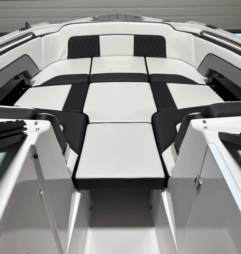 Slide: The Image of 2025 Monterey M-65 boat interior with sleek black and white seating design. - 3