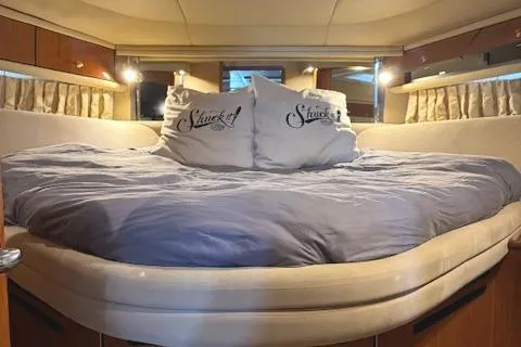 Slide: The Image of Luxurious bedroom interior of 2001 Sea Ray Sundancer 540 yacht with cozy bedding. - 11