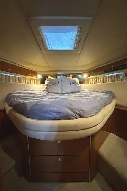 Slide: The Image of Luxurious cabin interior of 2001 Sea Ray Sundancer 540 yacht with cozy bedding. - 12