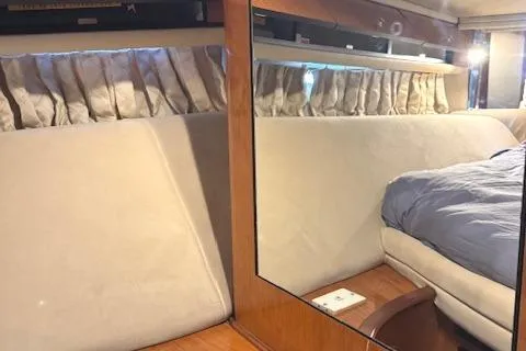 Slide: The Image of Interior cabin of 2001 Sea Ray Sundancer 540 yacht with bed and mirror. - 13