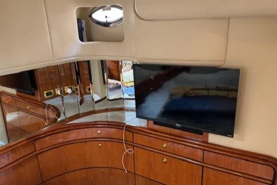 Slide: The Image of Interior of 2001 Sea Ray Sundancer 540 yacht with TV and wooden cabinetry. - 19