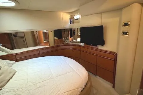 Slide: The Image of Luxurious interior of 2001 Sea Ray Sundancer 540 yacht with elegant wood cabinetry. - 20