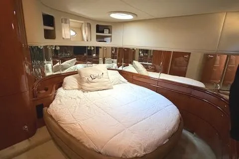 Slide: The Image of Luxurious bedroom interior of 2001 Sea Ray Sundancer 540 yacht with round bed. - 22