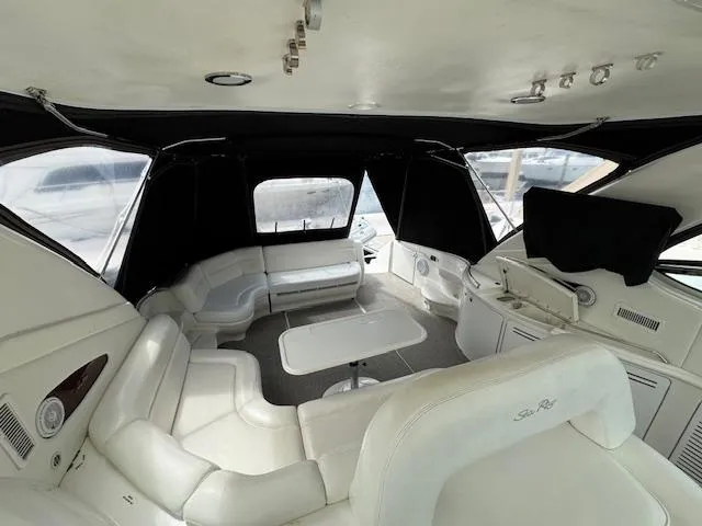 Slide: The Image of Interior of 2001 Sea Ray Sundancer 540 yacht with white leather seating and table. - 29
