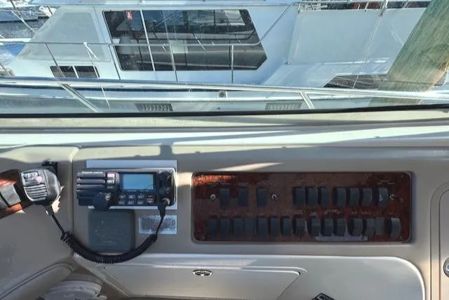 Slide: The Image of Control panel of a 2001 Sea Ray Sundancer 540 yacht, featuring navigation equipment. - 44