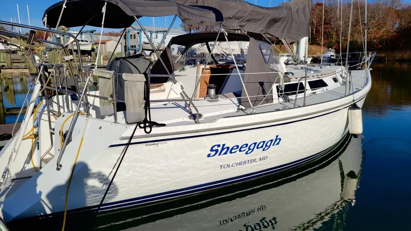 Slide: The Image of 1989 Catalina 42 sailboat named "Sheegogh" docked in Tolchester, MD. - 19