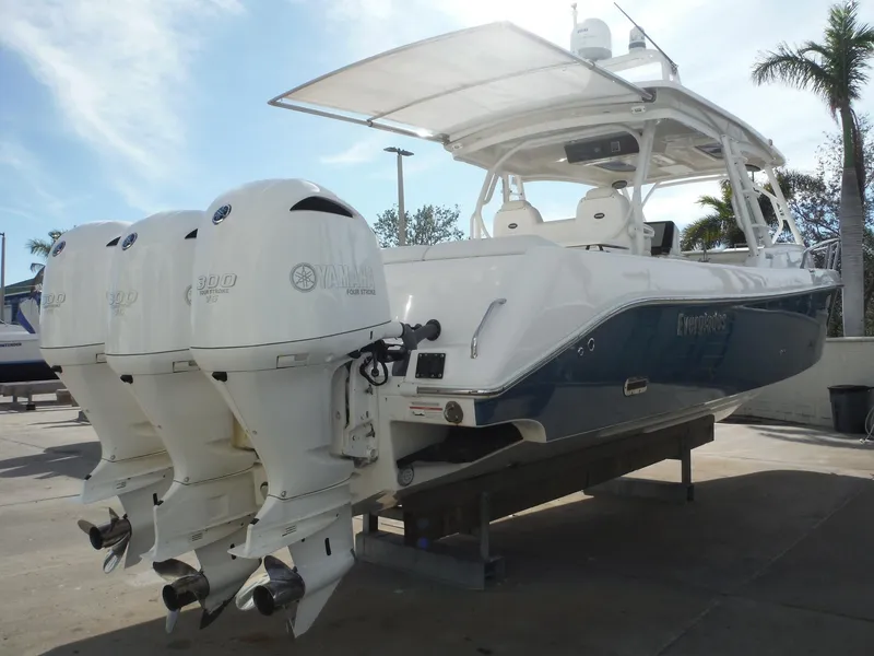 Slide: The Image of 2017 Everglades 360LXC boat with triple outboard engines on display. - 12