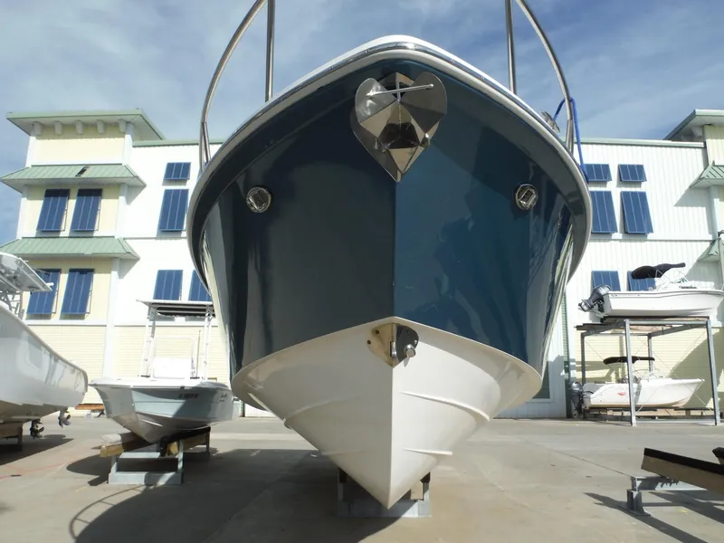 Slide: The Image of 2017 Everglades 360LXC boat docked in marina, front view. - 14