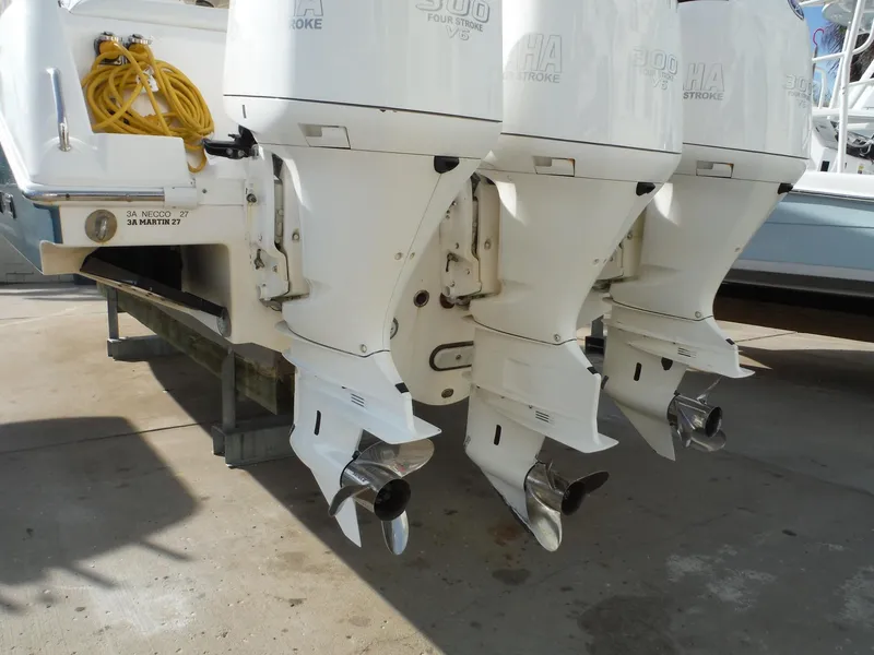 Slide: The Image of Triple outboard motors on a 2017 Everglades 360LXC boat. - 18