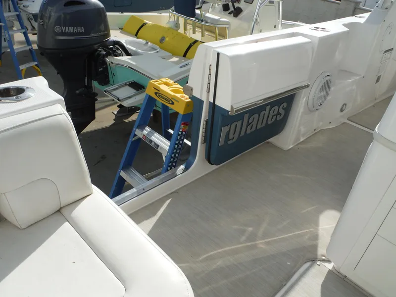 Slide: The Image of 2017 Everglades 360LXC boat interior with Yamaha engine and ladder. - 27