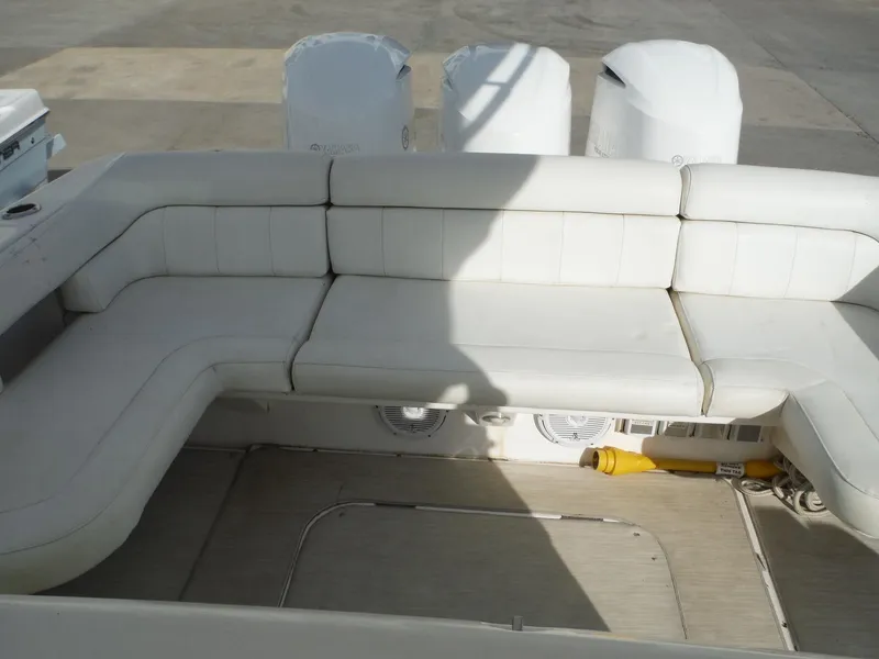 Slide: The Image of 2017 Everglades 360LXC boat with white cushioned seating and outboard motors. - 28