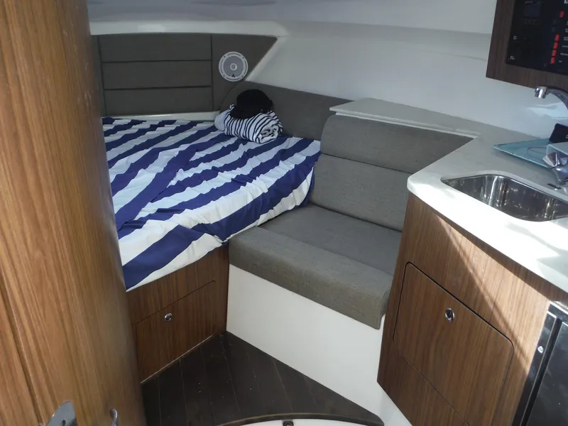 Slide: The Image of Interior cabin of 2017 Everglades 360LXC boat with bed and seating area. - 30