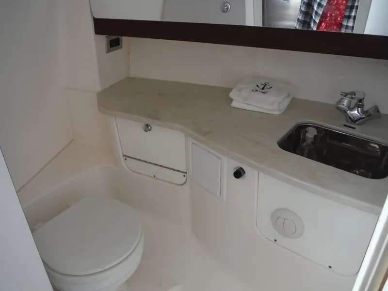 Slide: The Image of 2017 Everglades 360LXC boat bathroom with sink, toilet, and countertop. - 39