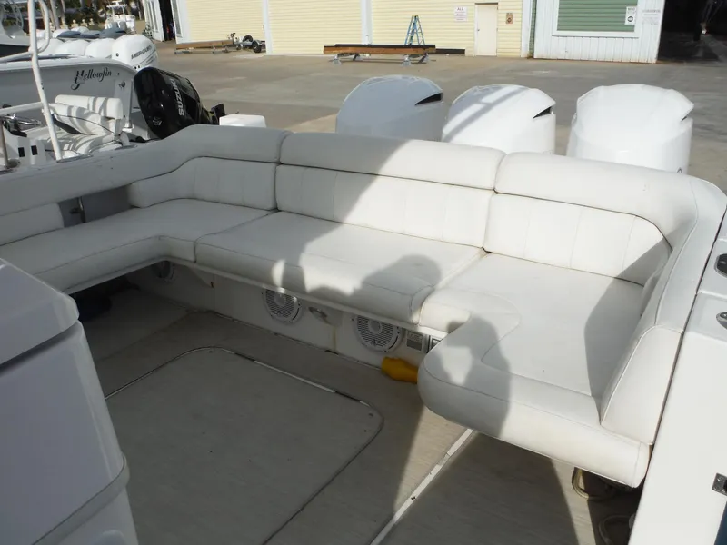 Slide: The Image of 2017 Everglades 360LXC boat with spacious white seating area. - 46
