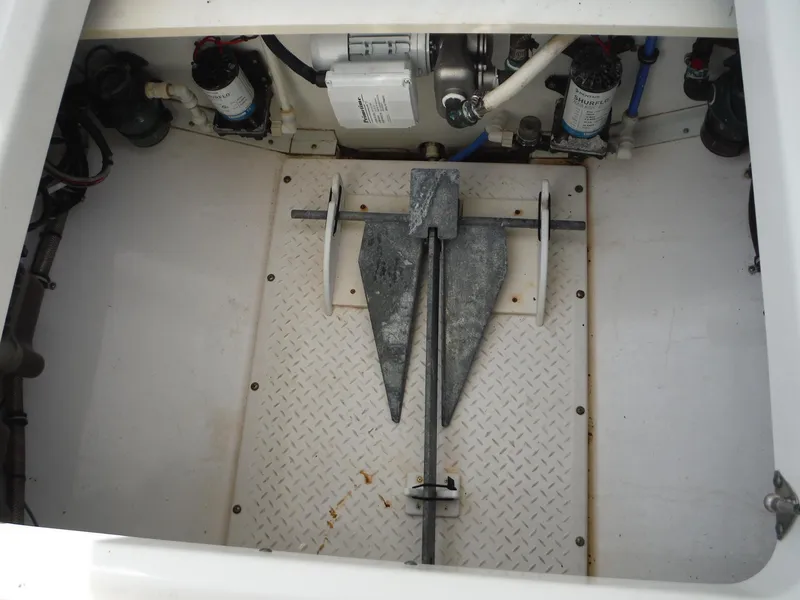Slide: The Image of 2017 Everglades 360LXC boat anchor compartment with equipment and wiring. - 48