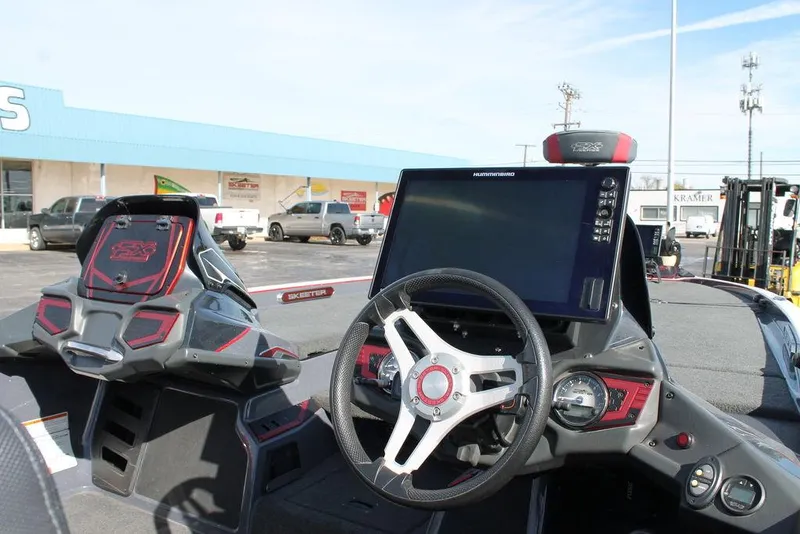 Slide: The Image of 2019 Skeeter FX21 Apex boat dashboard with steering wheel and navigation display. - 10