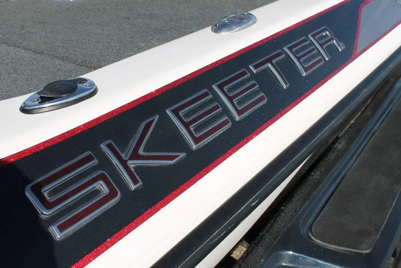 Slide: The Image of Close-up of 2019 Skeeter FX21 Apex boat logo with red accents. - 5