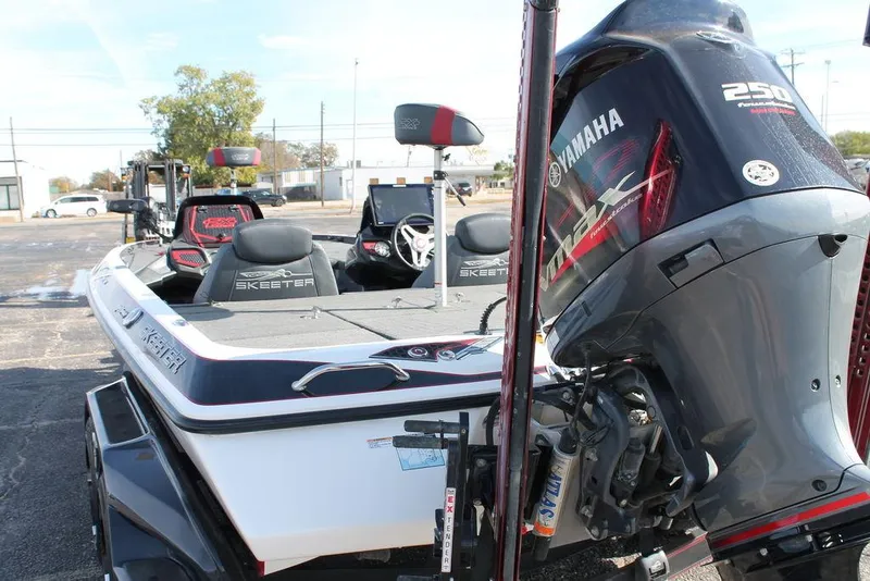 Slide: The Image of 2019 Skeeter FX21 Apex boat with Yamaha 250 engine, parked outdoors. - 6