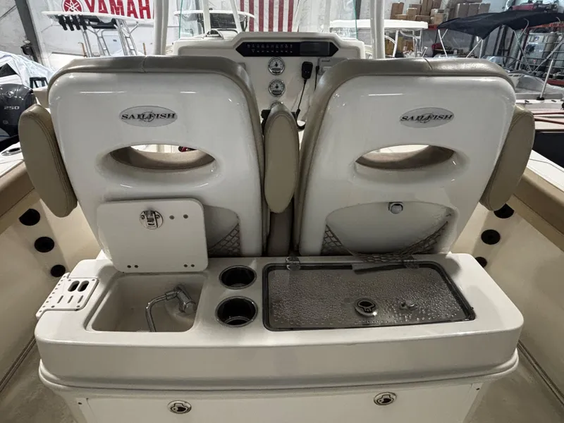 Slide: The Image of 2018 Sailfish 270 CC boat interior with dual seats and utility station. - 3