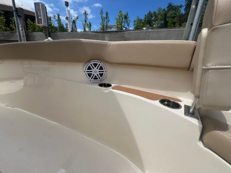 Slide: The Image of 2025 Scout 215 XSF boat interior with speaker and cup holders. - 4