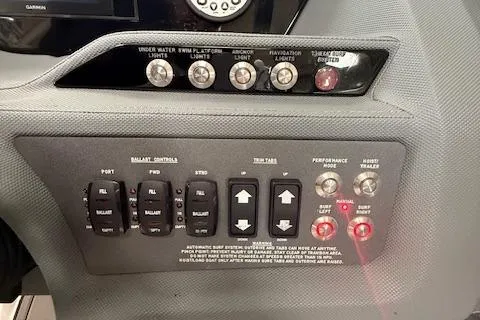 Slide: The Image of Control panel of a 2017 Cobalt R3 WSS Surf boat with ballast and trim tab switches. - 7