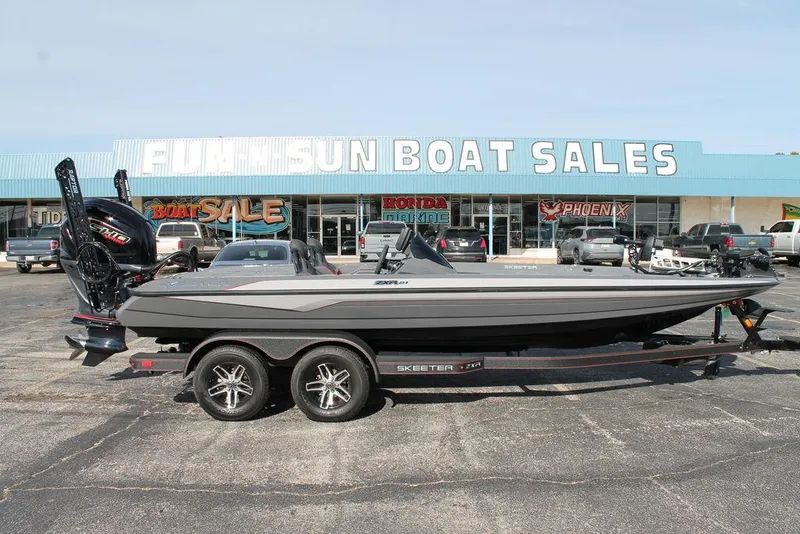 Slide: The Image of 2025 Skeeter ZXR21 boat at dealership, parked on trailer. - 1