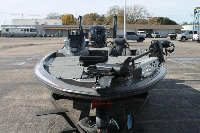 Slide: The Image of 2025 Skeeter ZXR21 fishing boat in a parking lot, showcasing its sleek design and equipment. - 3