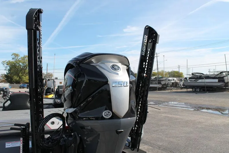 Slide: The Image of Skeeter ZXR21 2025 boat engine with Power-Pole anchors in a marina setting. - 7