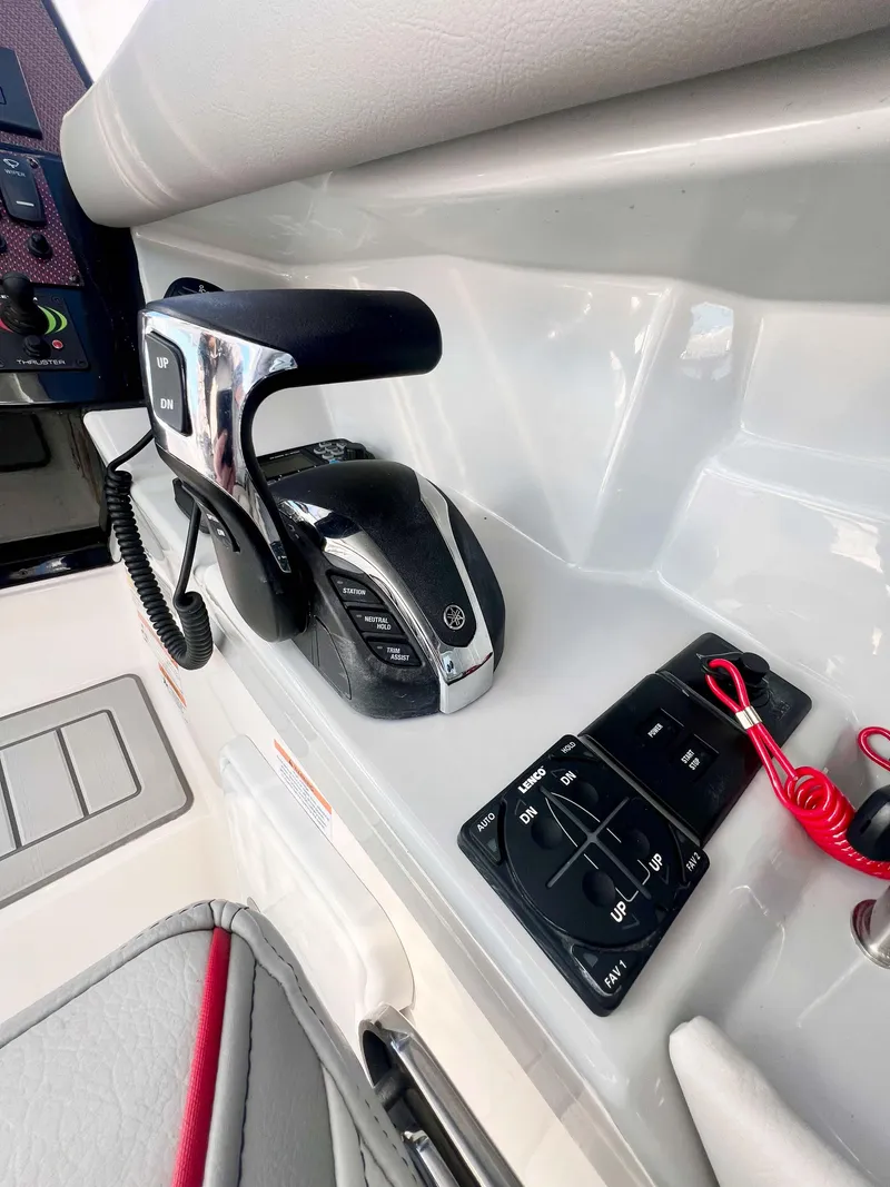 Slide: The Image of 2023 Solara S-250 DC boat controls with modern dashboard and sleek design. - 12
