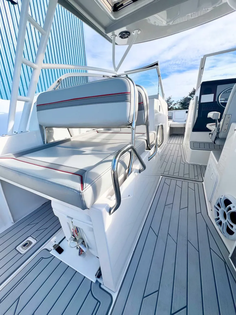 Slide: The Image of 2023 Solara S-250 DC boat interior with sleek seating and modern design. - 13