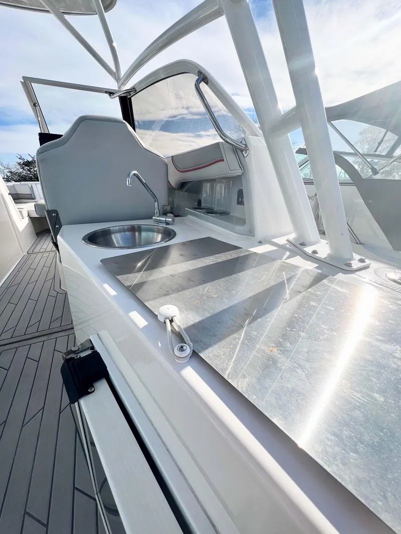 Slide: The Image of 2023 Solara S-250 DC boat with sleek kitchen area and stainless steel sink. - 16