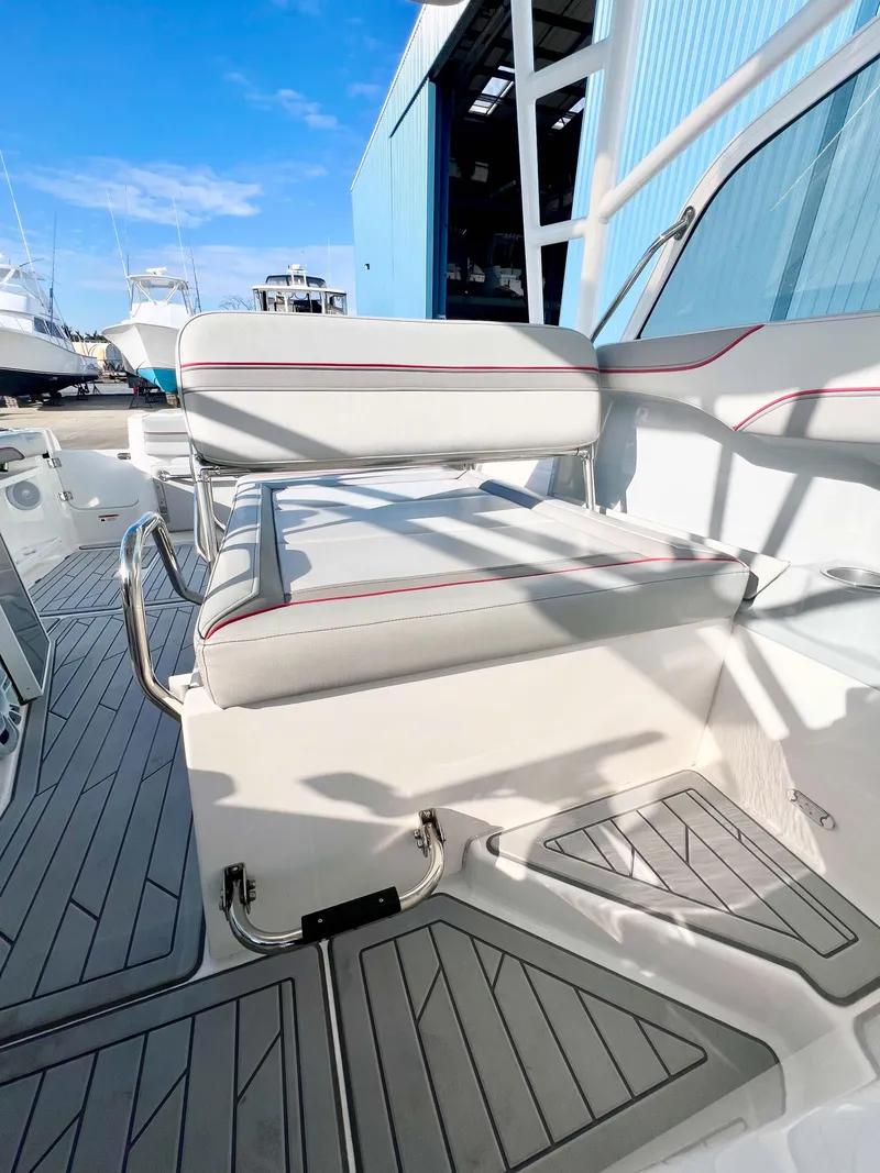 Slide: The Image of 2023 Solara S-250 DC boat interior with cushioned seating and sleek design. - 18