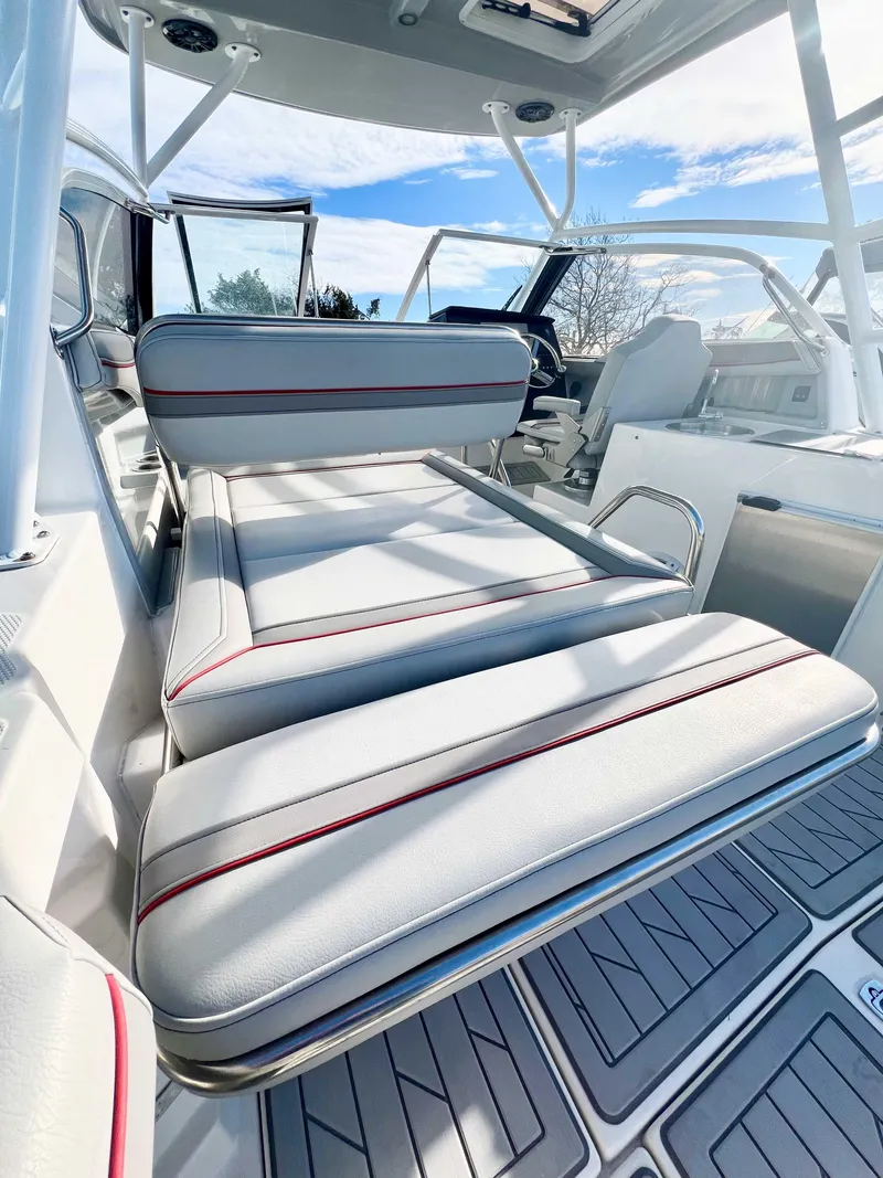 Slide: The Image of 2023 Solara S-250 DC boat interior with cushioned seating and modern design. - 19