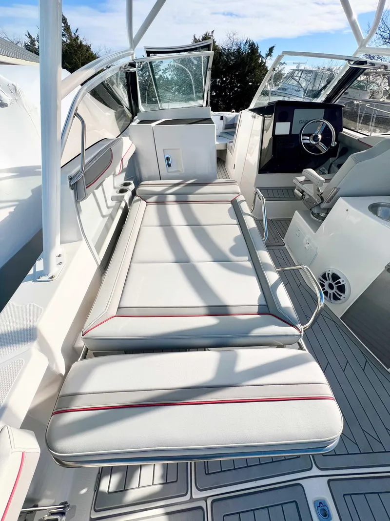 Slide: The Image of 2023 Solara S-250 DC boat interior with sleek seating and modern dashboard. - 20