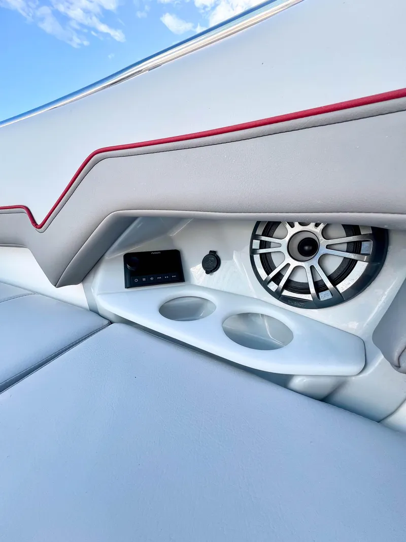 Slide: The Image of 2023 Solara S-250 DC boat interior with speaker and cup holders. - 28