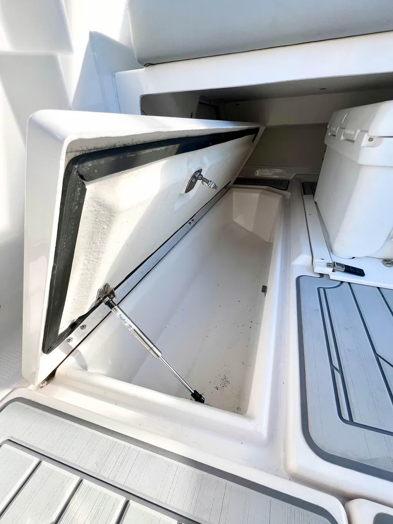 Slide: The Image of Open storage compartment on 2023 Solara S-250 DC boat deck. - 36