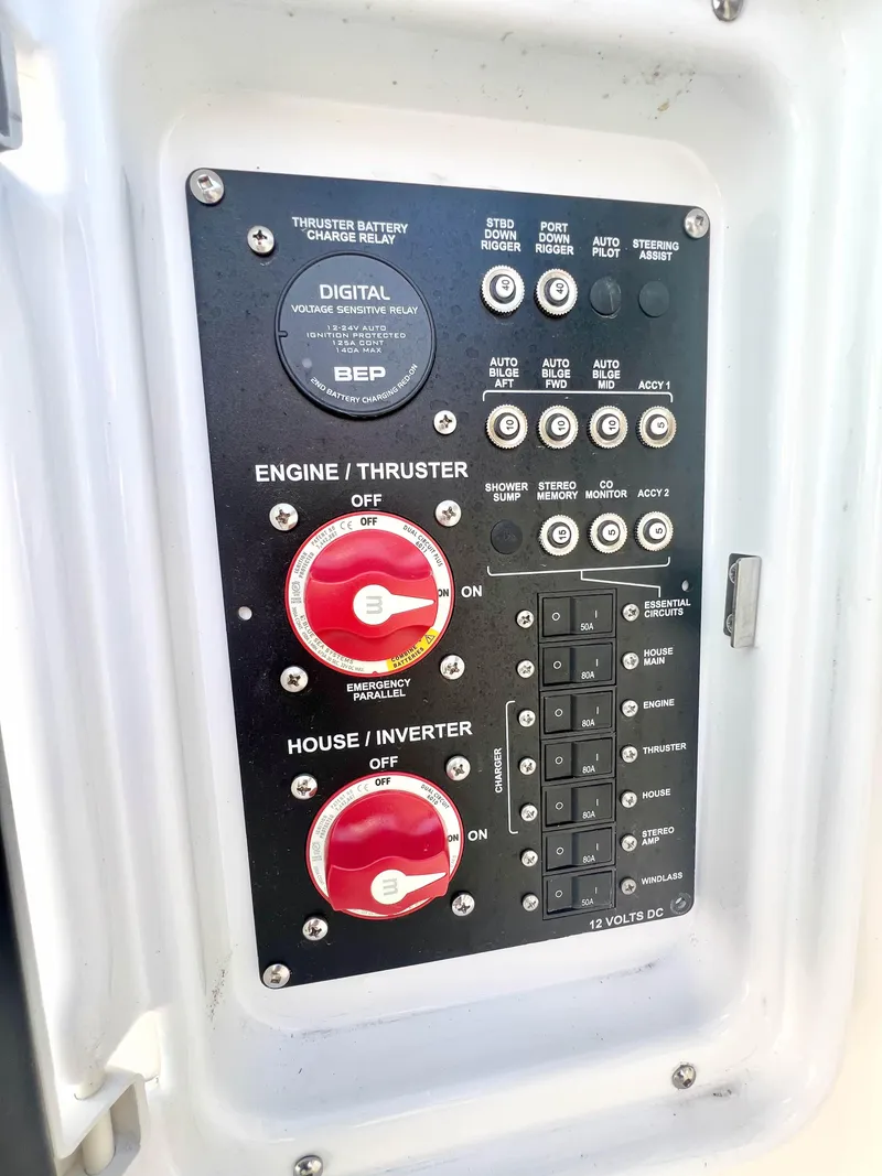 Slide: The Image of Control panel of 2023 Solara S-250 DC boat with switches and dials. - 38