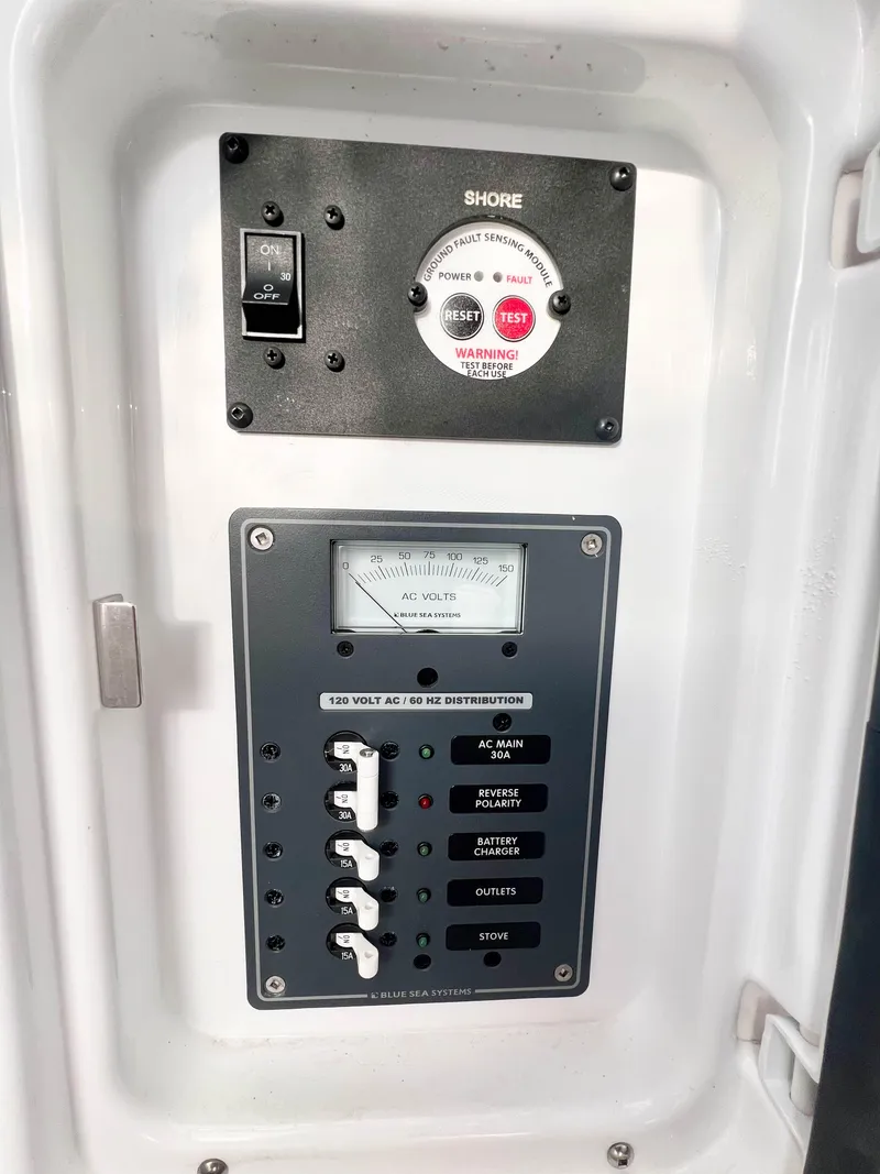 Slide: The Image of 2023 Solara S-250 DC electrical control panel with switches and voltage meter. - 39