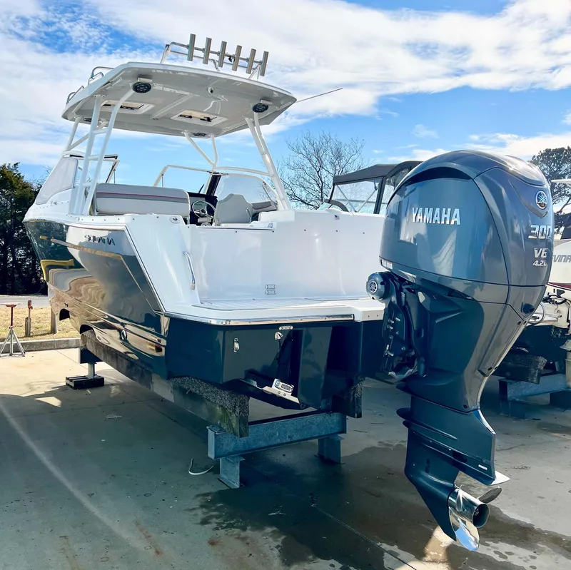 Slide: The Image of 2023 Solara S-250 DC boat with Yamaha outboard motor on display. - 4