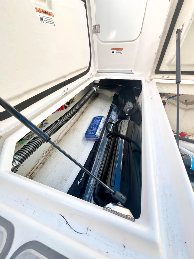 Slide: The Image of Storage compartment of 2023 Solara S-250 DC boat, showcasing interior details and equipment. - 42