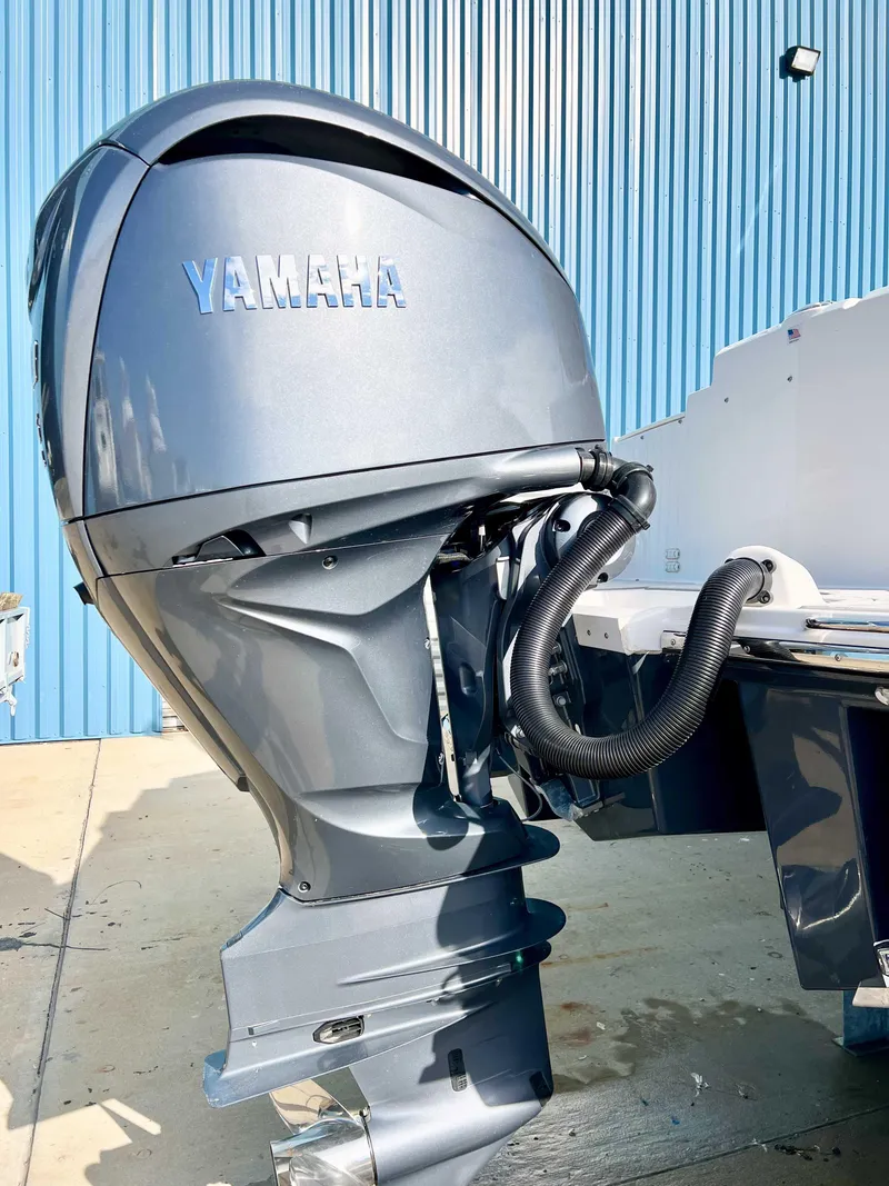 Slide: The Image of 2023 Solara S-250 DC with Yamaha outboard motor, blue background. - 7