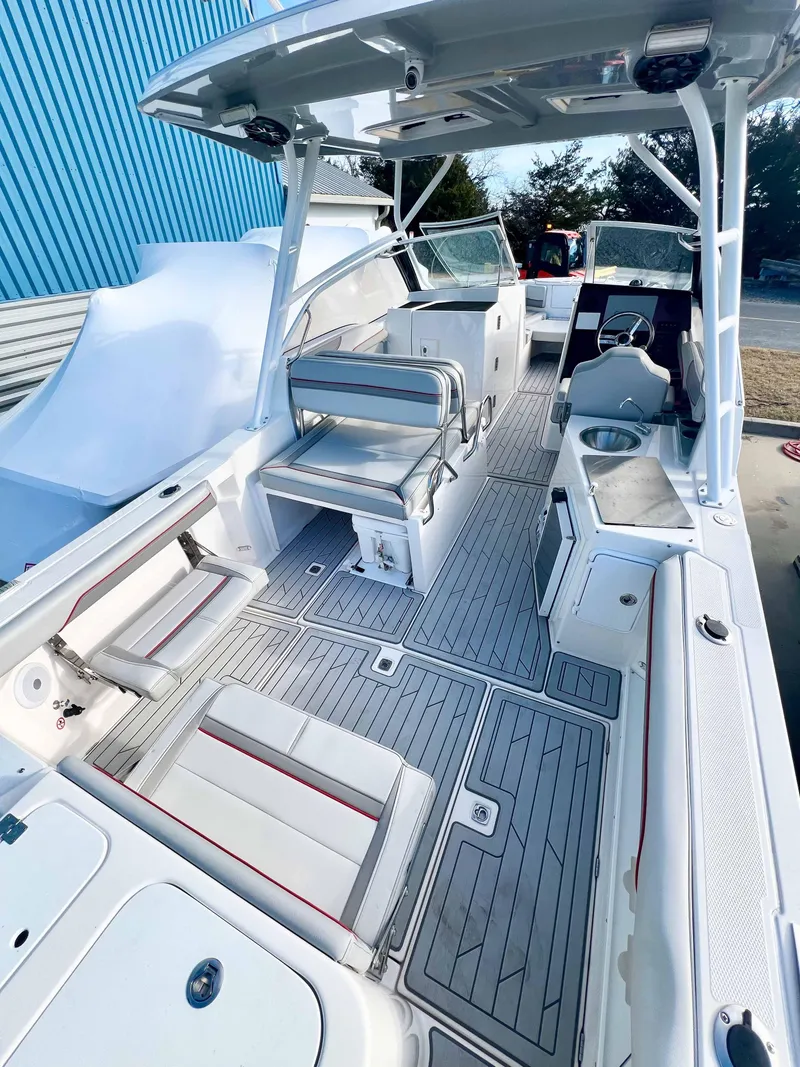 Slide: The Image of 2023 Solara S-250 DC boat interior with seating, helm, and modern amenities. - 8