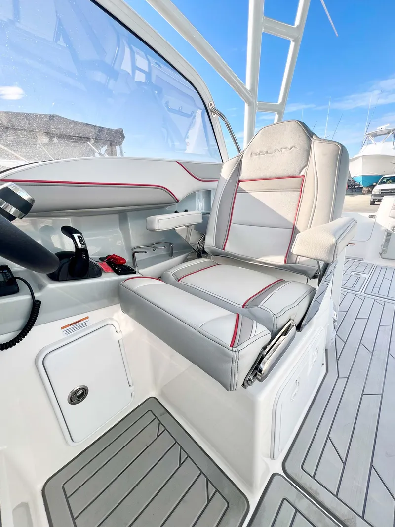 Slide: The Image of 2023 Solara S-250 DC boat interior with modern seating and sleek design. - 9