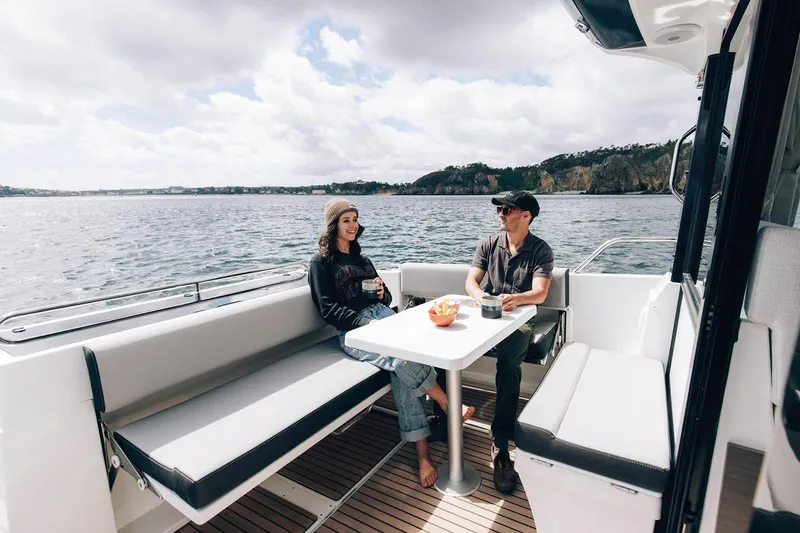 Slide: The Image of 2025 Jeanneau NC 895 Sport Series 2 boat with sleek seating and modern design. - 7