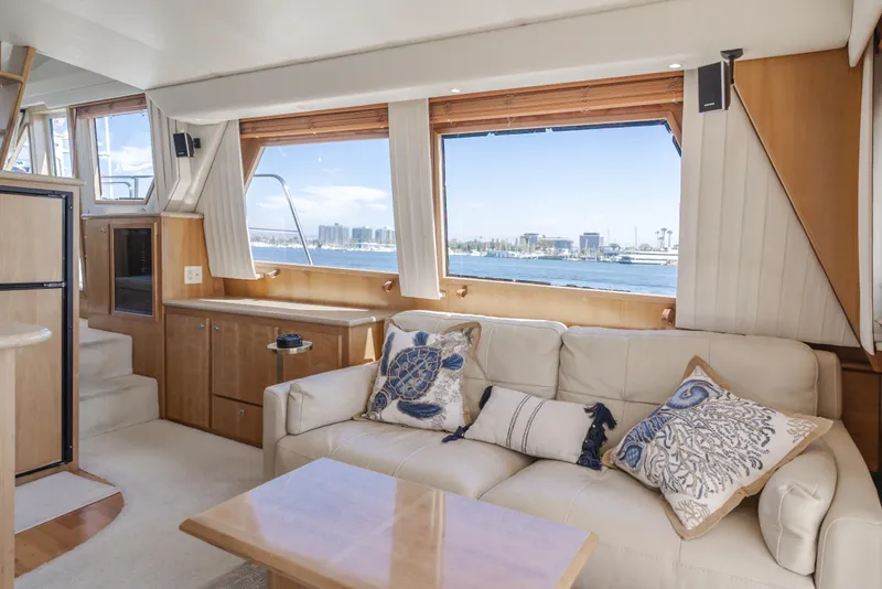 Slide: The Image of Luxurious 2007 Navigator Pilothouse yacht interior with plush seating and scenic ocean view. - 17