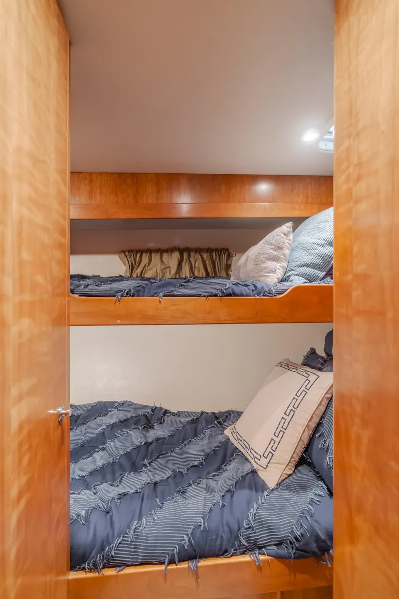 Slide: The Image of Bunk beds in 2007 Navigator Pilothouse yacht cabin with cozy bedding. - 21