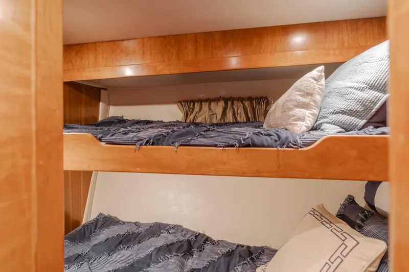 Slide: The Image of Bunk beds in 2007 Navigator Pilothouse yacht cabin with cozy bedding. - 22